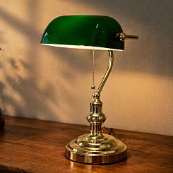 Westminster banker's table lamp on wooden desk with green glass shade and brass finish