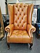 Old English tan leather Chesterfield wing chair