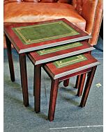 Nest of 3 mahogany Chippendale tables green leather top