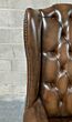 Wingback Chesterfield chair, antique tan leather