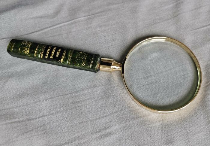 Magnifying glass with green handle