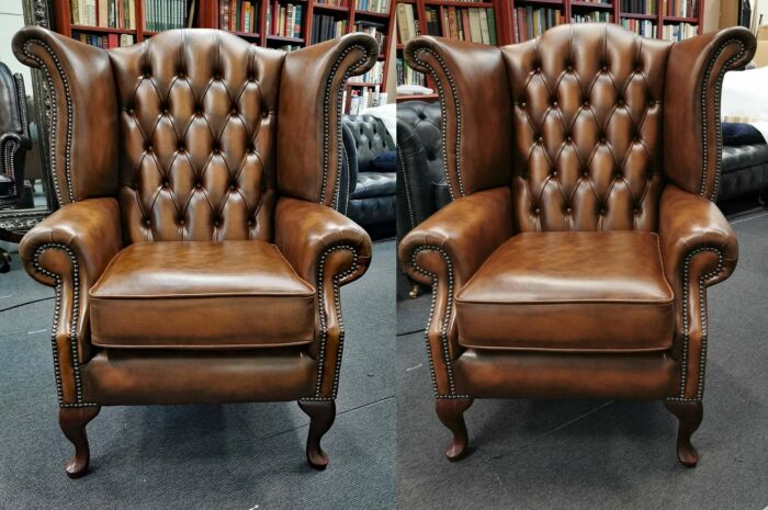 Scroll wing Chesterfield chairs in antique tan leather
