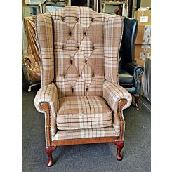 Chesterfield wing chair in beautiful woolen palid and antique tan leather
