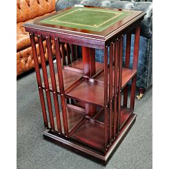 Revolving mahogany bookcase with green leather top