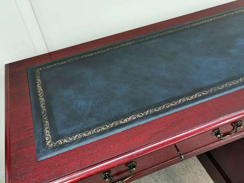 Blue leather on a mahogany desk